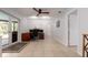 Bonus room featuring tile floors, access to a patio and a desk with computers at 4807 W Country Club Dr, Sarasota, FL 34243