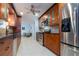Stylish kitchen featuring stainless steel appliances, custom cabinetry and a view through to the living area at 4807 W Country Club Dr, Sarasota, FL 34243