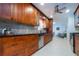 Stylish kitchen featuring stainless steel appliances, custom cabinetry and a view through to the living area at 4807 W Country Club Dr, Sarasota, FL 34243