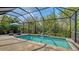 Inviting pool area with lush green surroundings, perfect for relaxation and recreation at 4832 Boston Common Gln, Bradenton, FL 34211