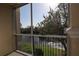 Relaxing screened patio with view of serene pond and lush landscaping at 5168 Northridge Rd # 209, Sarasota, FL 34238