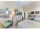 Bedroom featuring two chairs and decorations on the walls and dresser at 5224 88Th E St, Bradenton, FL 34211