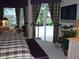 Bedroom with large windows overlooking the pool area and beautiful plaid decor at 5224 88Th E St, Bradenton, FL 34211