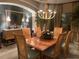 Elegant dining room boasts a stylish chandelier, seating for six, and sophisticated decor at 5224 88Th E St, Bradenton, FL 34211