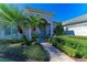 Inviting front exterior showcasing a well-manicured lawn and a charming walkway to the entrance at 5224 88Th E St, Bradenton, FL 34211