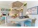Eat-in kitchen area with breakfast bar seating and modern decor at 5224 88Th E St, Bradenton, FL 34211