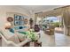 Bright living room boasts stylish decor, comfortable seating, and views of the lake at 5224 88Th E St, Bradenton, FL 34211