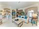 Open-concept living room with seamless flow to the kitchen, perfect for entertaining guests at 5224 88Th E St, Bradenton, FL 34211