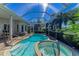 Enclosed pool and spa offer a tranquil setting, with the sun streaming through the screened enclosure at 5224 88Th E St, Bradenton, FL 34211