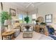 This comfy sitting room features many chairs, plants, and a nice view at 5224 88Th E St, Bradenton, FL 34211