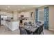 Spacious living area with an open-concept design, connecting the kitchen, dining, and living spaces at 5631 Silver Moonlight Dr, Palmetto, FL 34221