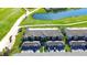 Aerial view of residential property with a community golf course and pond at 5685 Palmer Cir # 202, Bradenton, FL 34211