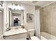 Clean bathroom featuring a single vanity, a tub, and neutral tile at 5685 Palmer Cir # 202, Bradenton, FL 34211