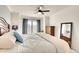 Serene bedroom with a plush bed, soft blue accents, and a window offering natural light at 5685 Palmer Cir # 202, Bradenton, FL 34211