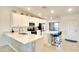 Bright kitchen features quartz counters, an island with seating, and modern stainless steel appliances at 5685 Palmer Cir # 202, Bradenton, FL 34211