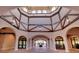 Stunning lobby with high ceilings, arched doorways, and decorative wood beams at 5685 Palmer Cir # 202, Bradenton, FL 34211