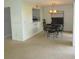 A view of the dining room with a dark wood table set for four at 5918 7Th W Ave # 5918, Bradenton, FL 34209