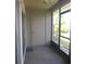 Enclosed lanai with concrete flooring, ceiling fan, and screen windows to the outside at 5918 7Th W Ave # 5918, Bradenton, FL 34209