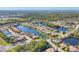 Expansive aerial view showcasing the community with picturesque lakes weaving through the neighborhood at 6600 Horned Owl Pl, Sarasota, FL 34241