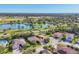 Beautiful aerial view of homes near a lake and a golf course at 6600 Horned Owl Pl, Sarasota, FL 34241