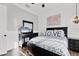 Chic bedroom with dark furniture, white paneling, and 'LOVE' pillows on the bed at 6600 Horned Owl Pl, Sarasota, FL 34241