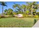 Welcome to Red Hawk Reserve community sign with lush landscaping and vibrant flowers at 6600 Horned Owl Pl, Sarasota, FL 34241