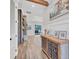 Beautiful hallway with decorative console table and wall art at 6600 Horned Owl Pl, Sarasota, FL 34241