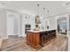 Spacious kitchen features a large island with seating and modern appliances at 6600 Horned Owl Pl, Sarasota, FL 34241