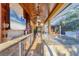 Outdoor kitchen with stainless steel appliances and stone countertops at 6600 Horned Owl Pl, Sarasota, FL 34241