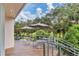 An outdoor patio featuring tables, umbrellas, and scenic views offers a relaxing spot for outdoor dining and socializing at 7718 Heathfield Ct, University Park, FL 34201