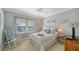 Charming bedroom with a cozy rocking chair and bright window, decorated with blue and white accents at 7910 34Th W Ave # 203, Bradenton, FL 34209