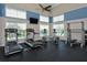 Well-equipped gym with treadmills, ellipticals, weight rack, and large windows offering exterior views at 7910 34Th W Ave # 203, Bradenton, FL 34209