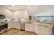 Modern kitchen featuring white cabinets, granite countertops, stainless steel appliances, and an open layout at 7910 34Th W Ave # 203, Bradenton, FL 34209