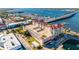 An aerial view overlooking the condo property near the marina, bridge, and downtown area at 808 3Rd W Ave # 205, Bradenton, FL 34205