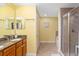 Bathroom with granite vanity and tiled glass enclosed shower at 808 3Rd W Ave # 205, Bradenton, FL 34205