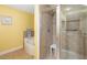 Bathroom showcasing a tub and a glass enclosed shower with seat at 808 3Rd W Ave # 205, Bradenton, FL 34205