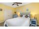 Bright bedroom features coastal decor, ceiling fan, and plush carpeting at 808 3Rd W Ave # 205, Bradenton, FL 34205