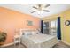 Comfortable bedroom with ceiling fan and large window at 808 3Rd W Ave # 205, Bradenton, FL 34205