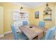 Bright dining area with skylight and a decorative china cabinet at 808 3Rd W Ave # 205, Bradenton, FL 34205