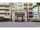 Elegant entrance to River Dance with covered entry and well-maintained landscaping at 808 3Rd W Ave # 205, Bradenton, FL 34205