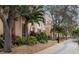Well-maintained condo building near the sidewalk and lush greenery adding curb appeal to the property at 808 3Rd W Ave # 205, Bradenton, FL 34205