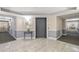 Wide hallway boasts decorative lighting, wall trim, neutral paint, and access to elevators at 808 3Rd W Ave # 205, Bradenton, FL 34205