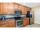 Charming kitchen with stainless steel appliances and granite countertops at 808 3Rd W Ave # 205, Bradenton, FL 34205
