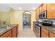 Bright kitchen with granite counters and stainless steel oven at 808 3Rd W Ave # 205, Bradenton, FL 34205