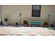 A relaxing backyard featuring white gravel, potted plants, and a cozy bench at 820 Coconut Rd, Venice, FL 34293