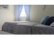 Comfortable bedroom featuring soft blue accents and bright natural light at 820 Coconut Rd, Venice, FL 34293