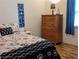 Bedroom with nautical decor, laminate flooring, and side table at 820 Coconut Rd, Venice, FL 34293