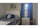 Bedroom with white furniture and nautical themed decorations at 820 Coconut Rd, Venice, FL 34293