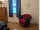 Bedroom with nautical decor, laminate flooring, and dark curtains at 820 Coconut Rd, Venice, FL 34293