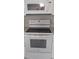Modern kitchen appliances in white finish including oven, stovetop, and microwave at 820 Coconut Rd, Venice, FL 34293